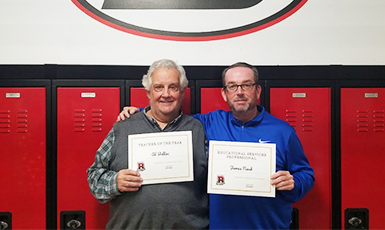  Educators pose with their certificates in honor of being named educators of the year